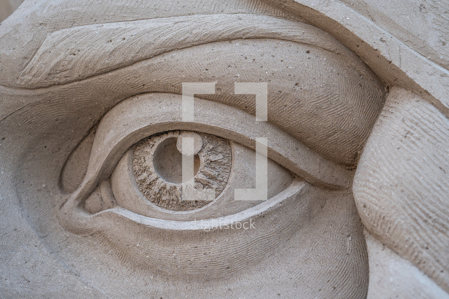 Detail of an eye from a sand sculpture