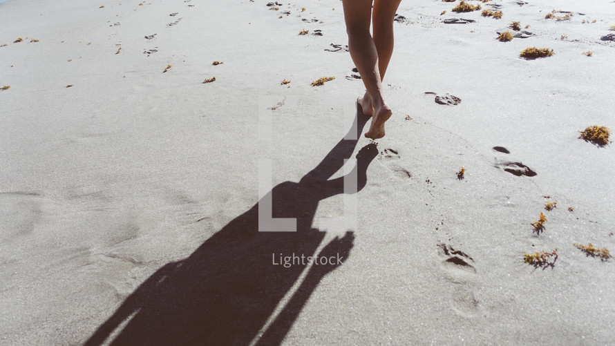 walking barefoot on a beach 