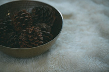 pine cones in a bowl 