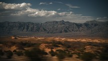 View from the car window of dunes and mountain in Death Valley