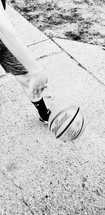 child playing basketball in his driveway 