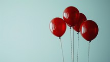  Red Balloons Floating Against Blue Background