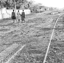 people walking on a dirt road in Ethiopia 
