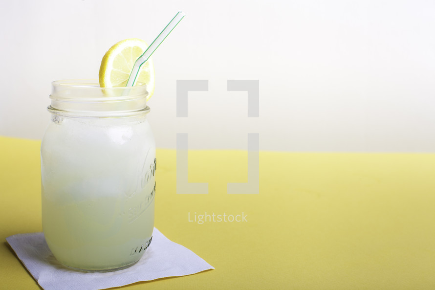 glass of lemonade on a napkin 