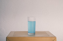glass of blue water 
