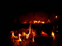 Flames Around a Log in a Fireplace