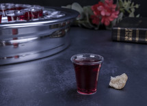 Communion glass cups on tray filled with wine, the symbol of Jesus Christ blood 