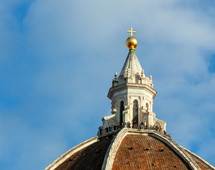 Detail of the dome of Florence cathedral of Santa Maria del Fiore. A group of tourists on the viewing platform at the top of the Brunelleschi Dome of the cathedral.