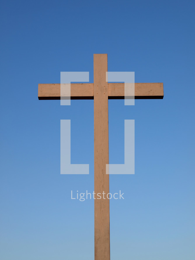 Christian cross over a blue sky background