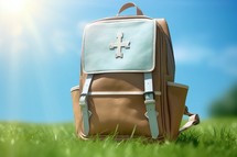 Backpack on the Grass with Blue Background