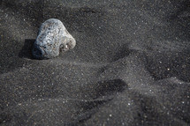 rock on black sand 