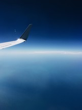 a wing of a plane in flight 