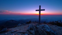 cross on the top of the mountain at sunrise with a beautiful sky