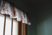 the interior of old farmhouse with vintage curtain