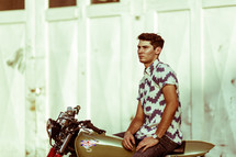 portrait of a man sitting on a motorcycle 
