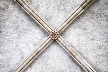 X in stone on a ceiling 