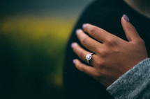 an engagement ring on a woman's hand 