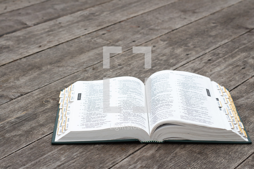 open Bible and wood background 