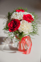 roses and carnations in a vase 