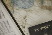 Bible and passport on a world map, missions preparation 