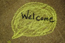 word welcome in a talk bubble 