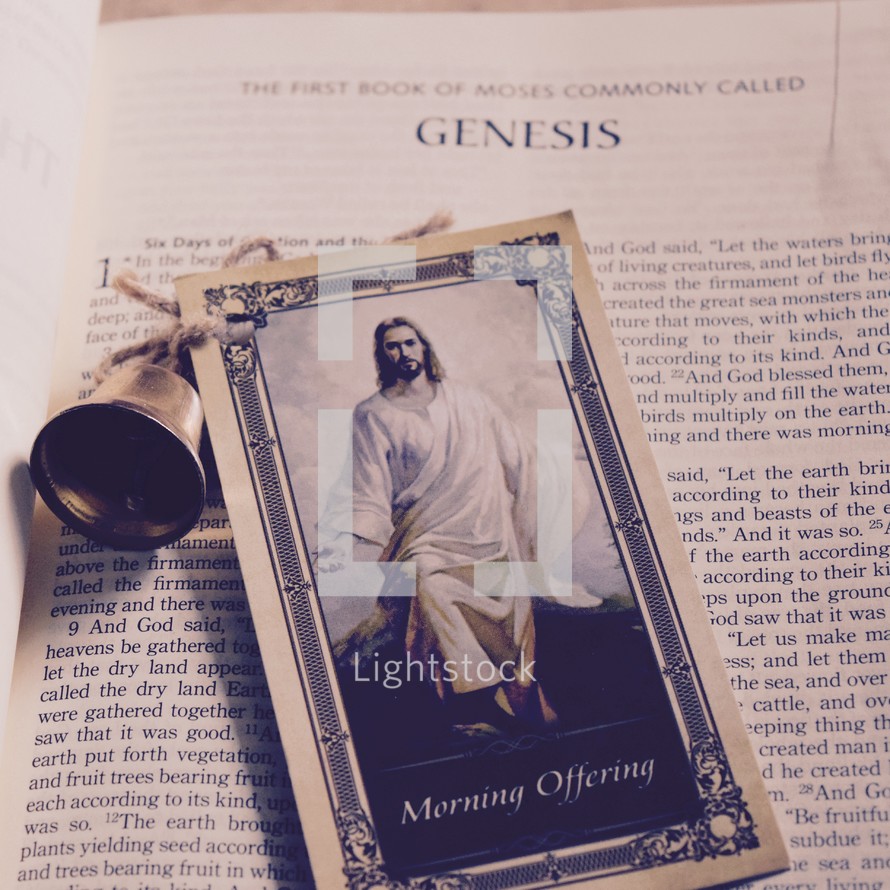 Morning Prayer card with a picture of Jesus and a bell on the pages of a Bible 