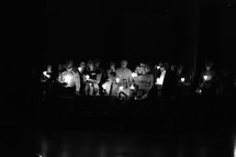 congregation holding candles at Easter Vigil Mass 