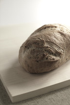 A loaf of bread on a cutting board