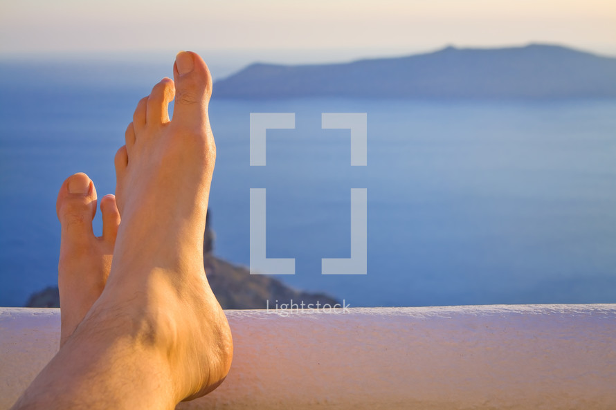 relaxing feet by the sea