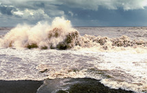 Wave crashing onto the shore