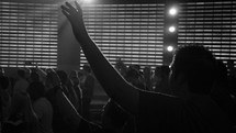 raised hands in a worship service 