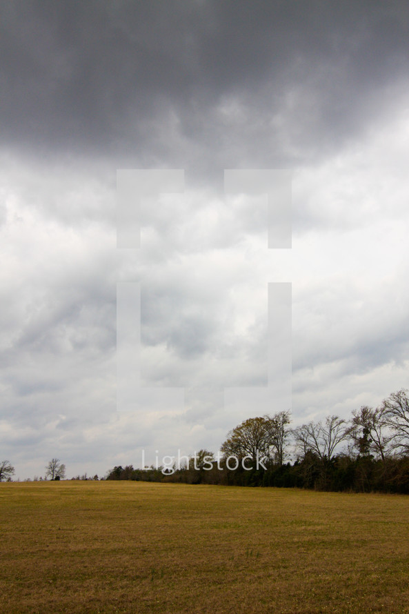 rain clouds over a field 