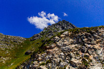 rocky mountain peak under a blue sky