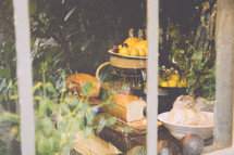 view of bread and lemons through a kitchen window 