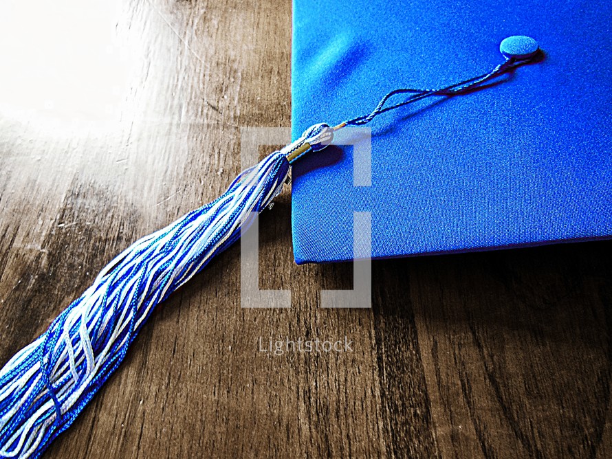 blue graduation cap and tassel 
