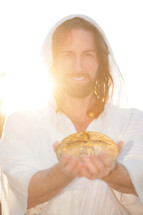 Jesus holding a loaf of bread. 