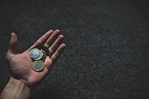 hand holding coins 