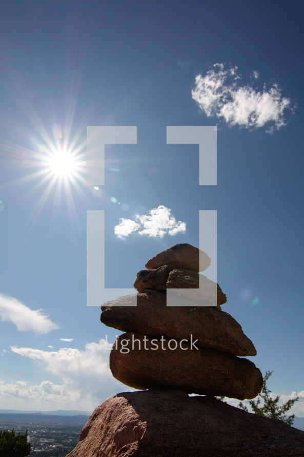 sunburst and stacked rocks