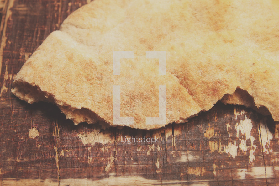pita bread on wood board