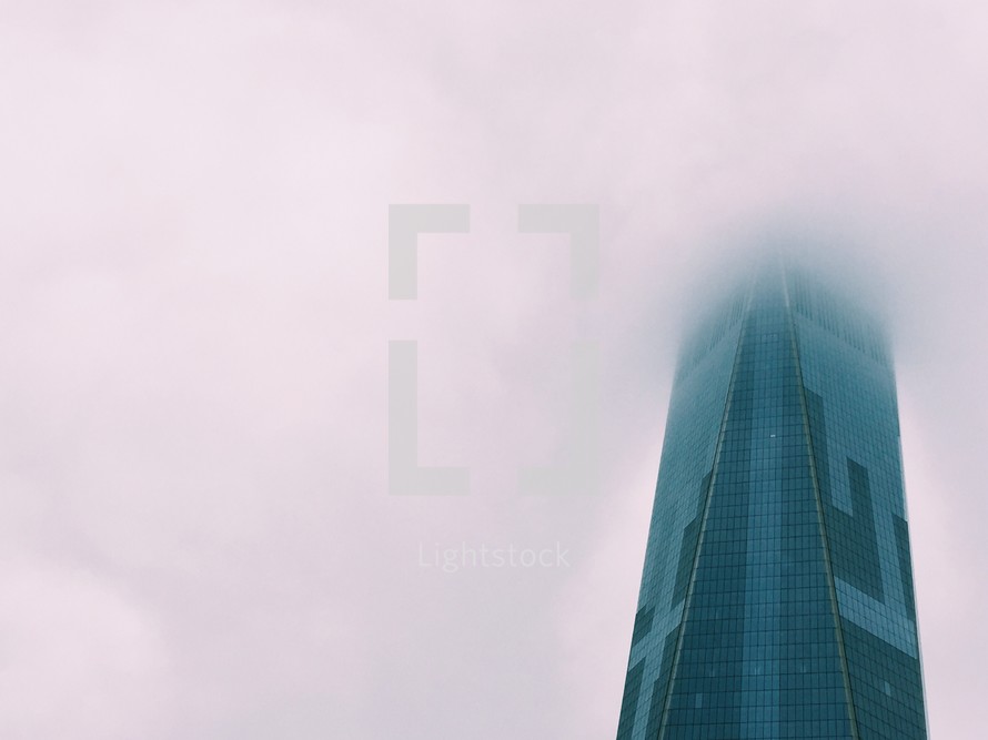 skyscraper in fog 