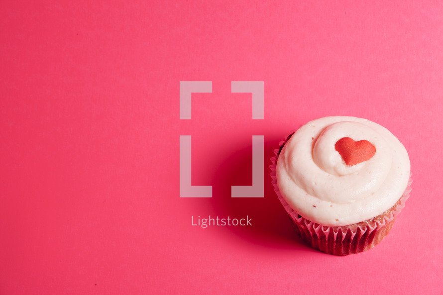 Valentines Day cupcake on pink background