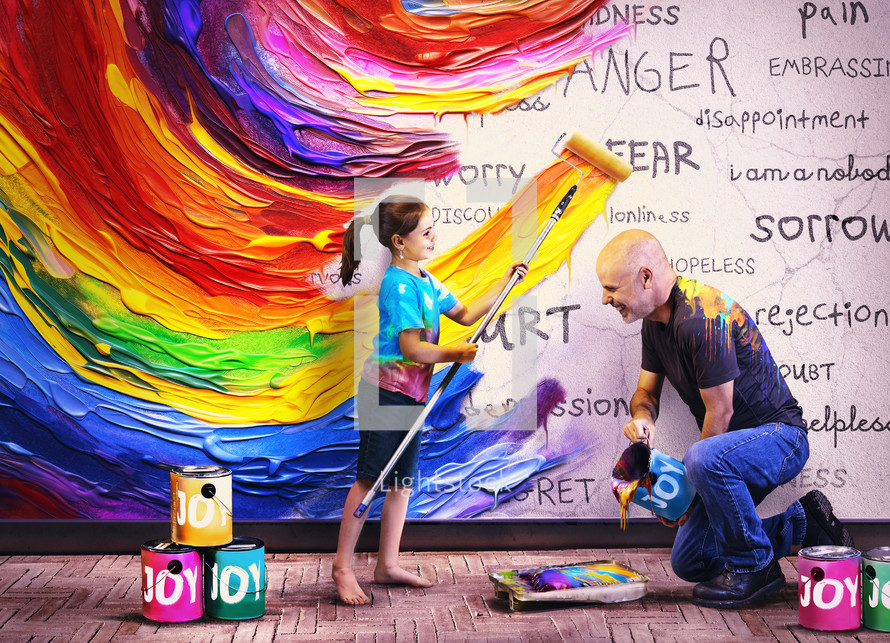 Father and daughter paint vibrant colors
