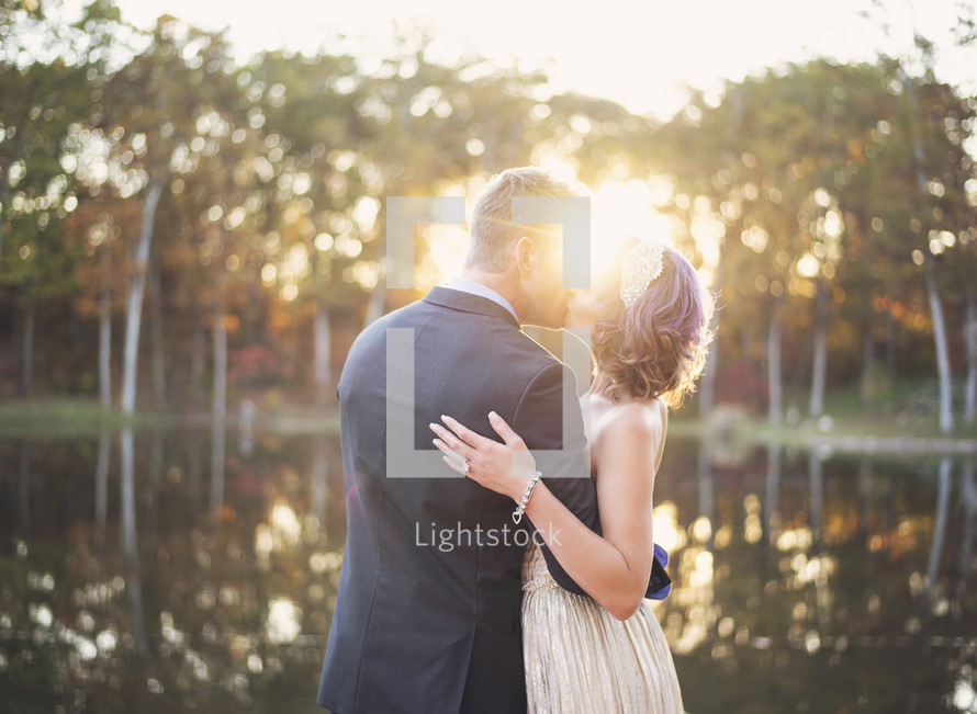 portrait of a bride and groom kissing 