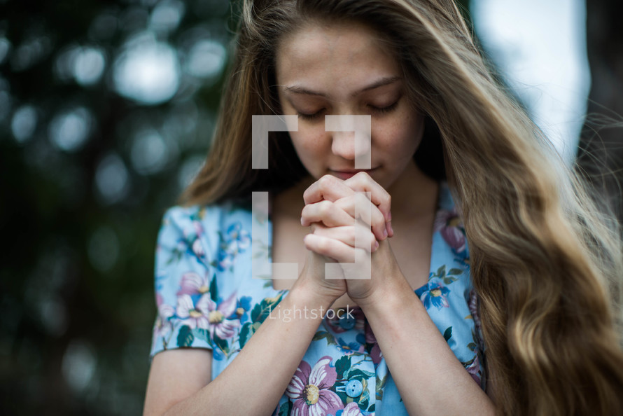 young woman in prayer 
