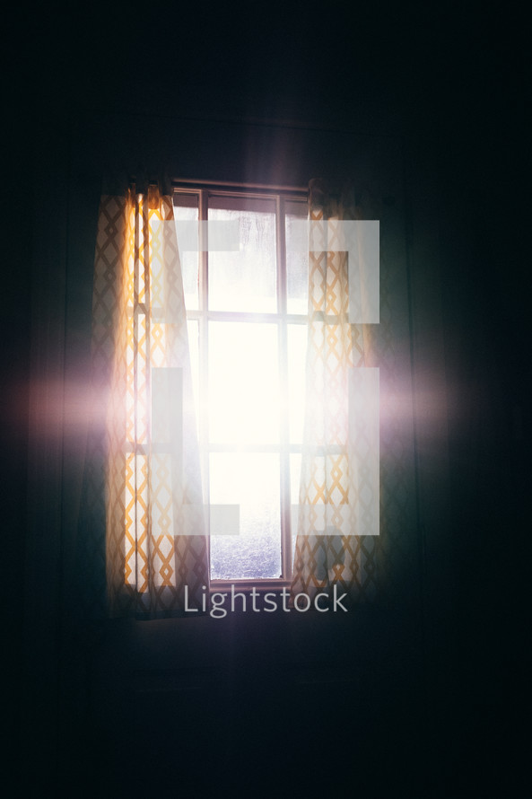 sun flare cross in a window 