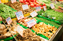mushrooms and vegetables in a market 