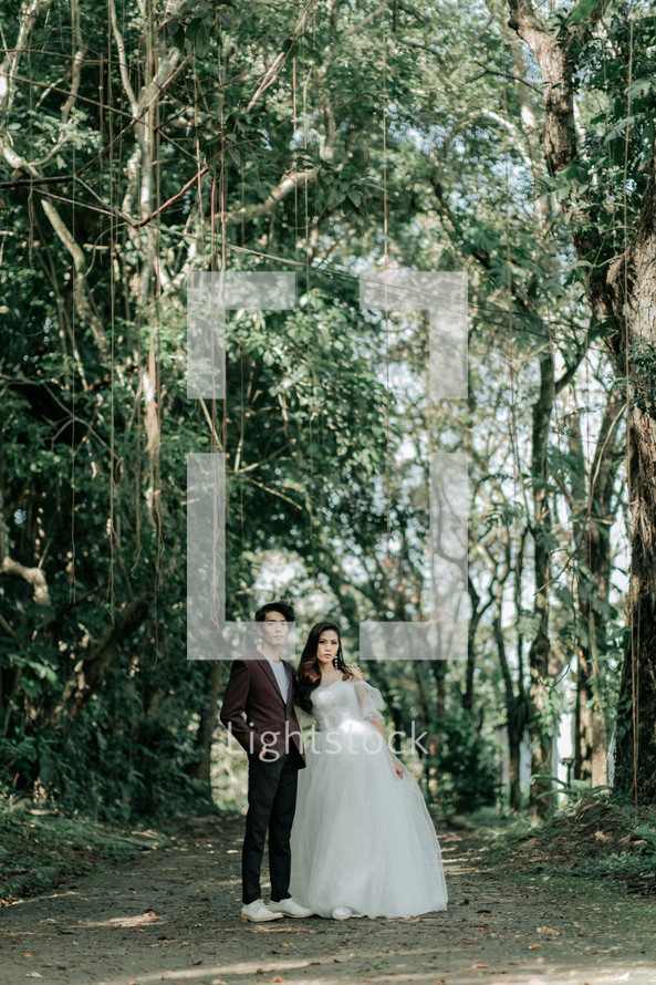 portrait of a bride and a groom in jungles 