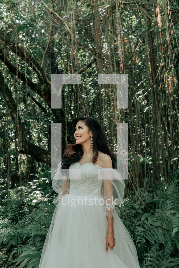 a bride standing in the jungles 