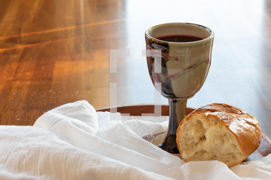 bread and wine on a wood background 