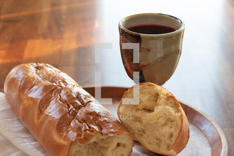 bread and wine on a wood background 